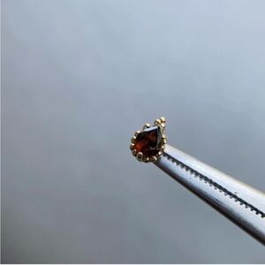 Gently used Sacred Symbols threadless end with ruby in yellow gold❤️❤️❤️